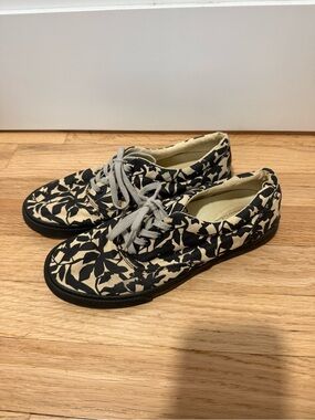 Bucket Feet Black Floral Canvas Sneakers with Cream Background